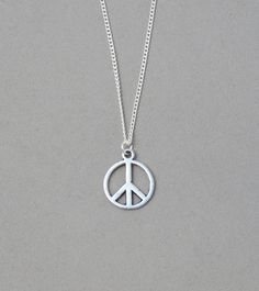 "Small peace sign necklace The peace sign is silver plated charm and measures 5/8\" x 1/2\". It is strung on a silver plated tiny 1.3 mm silver plated curb chain with a lobster clasp closure. Choose your length from the drop down list. To add a birthstone charm to this necklace, follow link below. https://www.etsy.com/listing/634099372/add-a-birthstone-charm?ga_search_query=add&ref=shop_items_search_1" Adjustable Sterling Silver Peace Sign Jewelry, Symbolic Silver Jewelry With Peace Sign, Peace Sign Necklace, Sign Necklace, Pretty Necklaces, Birthstone Charms, The Peace, Curb Chain, Peace Sign