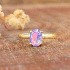 Lavender opal ring for women, Minimalist ring, fire opal jewelry, Statement ring, AAA Ethiopian opal ring, Natural fire opal jewelry, 925 Sterling silver ring, Gold Filled ring, Gift for her. *Other Similar Jewelry Available Here* https://www.etsy.com/shop/AreebaJewelry Details:- Gemstone - Ethiopian opal  Stone Color - Natural  Stone Setting - Prong Quality - AAA Grade Rize Size - 4 US TO 9 US Available Type - 100% Natural  Shipping service - Free worldwide shipping service About AreebaJewelry: Lavender Opal, Fire Opals Jewelry, Ethiopian Opal Ring, Rainbow Fire, Fire Opal Ring, Gold Filled Ring, Jewelry Statement, Ring Minimalist, Stone Setting