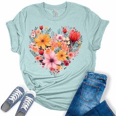 Style: Add some sunshine to your wardrobe with our stylish flower shirts for women! These graphic tees for women are the perfect blend of style and comfort and are sure to add some fun and fashion to your attire. Quality: Our nature lover tops for women are designed and printed with love in the USA. We use high-quality inks on our premium Bella Canvas unisex sunflower tshirt for a bold and stylish look. Fabric: Our womens tops are crafted with a premium blend of 100% Airlume combed and ring-spun Casual Heart Print T-shirt For Spring, Spring Heart Graphic T-shirt, Casual Heart Graphic T-shirt For Spring, Trendy Heart Print T-shirt For Spring, Casual T-shirt With Heart Graphic For Spring, Spring Graphic Tee With Heart Design, Spring Heart Print Crew Neck T-shirt, Spring Heart Print Crew Neck Tops, Spring Cotton T-shirt With Heart Graphic