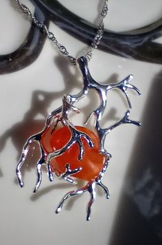 Genuine Fire Opal Rough in the arms of a silver branch. Rich red and orange in this large piece over 2cttw of rare fire opal rough. On an 18" Sterling Silver chain. So unique. Fire Jewelry, Branch Necklace, Red And Orange, Silver Accessories, Sterling Silver Chain, Fire Opal, Sterling Silver Chains, Charm Necklace, Silver Chain