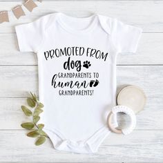 a baby bodysuit with the words,'proud to be an animal grandparents'on it