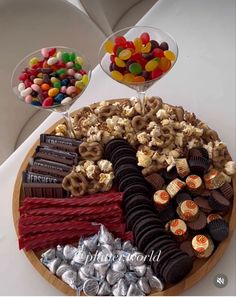 a platter filled with lots of different types of candy and candies on top of it