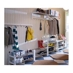 a white coat rack filled with coats and shoes next to a checkered floor in a room