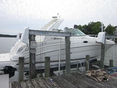 a boat is docked at the dock with other boats