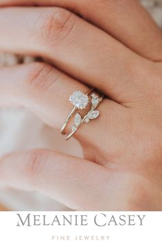 a woman's hand with a ring on it and the words melanie casey fine jewelry