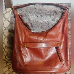 The Color And Style Of This Bag Makes It A Great Statement Piece For Your Closet. This Leather Bag Is Timeless With The Beautiful Color Cognac. Frye Bags, Hobo Purse, Cognac, Bag Making, Statement Pieces, Beautiful Colors, Leather Bag, Bag Lady, Purse