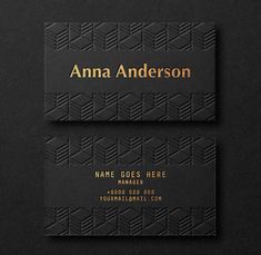 two black business cards with gold foil on them, one has an image of the same pattern