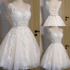 a white dress with flowers on the back and laces on the front, in three different views