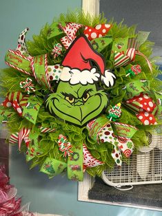 a christmas wreath with the grin face on it