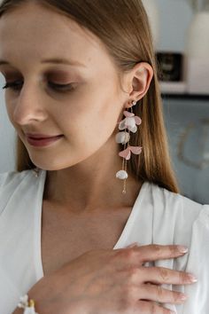 Iconic earrings in dirty pink and white colors and a smaller version. Earrings with charming, velvet flowers and ethereal, silk ones will emphasize various styles beautifully and in an unforced way. They will add charm and charm to romantic and sensual ones, and subtlety and originality to classic ones. Length - 11 cm, width - about 2 cm. Pink Teardrop Flower Earrings For Wedding, Pink Dangle Danglers For Wedding, Pink Danglers For Wedding, White Long Drop Bridal Earrings For Wedding, White Long Drop Chandelier Earrings For Wedding, White Long Drop Single Bridal Earring, Dangle Flower Earrings For Wedding, White Drop Earrings Danglers For Wedding, White Dangle Linear Earrings For Wedding