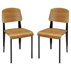 two wooden chairs sitting side by side