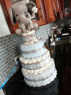 a very large cake made to look like an elephant on top of it's diaper