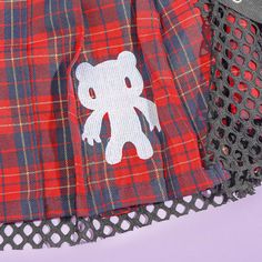 Elevate your kawaii style with this cute ACDC RAG plaid skirt with a black mesh overlay! It also features a white illustration of Gurumi or Gloomy Bear by Japanese illustrator, Mori Chack. The famous Japanese clothing brand is also known for its unique take on Harajuku fashion. Made from soft polyester material Features a black mesh overlay and removable straps Skirt length: 45 cm Waist: 70 - 90 cm Cheap Harajuku Skirt, Acdc Rag Gloomy Bear, Fitted Harajuku Style Red Skirt, Gloomy Bear Sweater, Gloomy Bear Accessories, Japanese Clothing Brands, Strap Skirt, Kawaii Backpack, Besties Forever