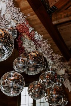 several disco balls hanging from the ceiling