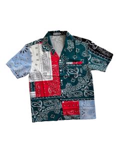 Elevate your wardrobe with our stylish and versatile unisex satin short sleeve shirt! Crafted from high-quality satin fabric, this shirt offers a luxurious feel and a polished look. The vibrant bandana print combined with a bold colorblock design makes this piece a standout addition to any outfit. Perfect for any occasion, from casual outings to chic events. Features: - Premium Satin Fabric: Soft, smooth, and comfortable for all-day wear. - Unisex Design: Flattering fit for everyone. - Vibrant Bandana Print: Eye-catching and trendy. - Colorblock Design: Adds a modern twist to the classic bandana print. - Straight Hem: Offers a clean, sophisticated finish. - Chest Pocket: Functional and stylish for added convenience. Details: - Material: 100% Satin - Sleeve Length: Short - Fit: Regular Whet Patchwork Short Sleeve Shirt For Streetwear, Short Sleeve Patchwork Shirt For Streetwear, Casual Multicolor Print Shirt With Patchwork, Casual Multicolor Patchwork Print Shirt, Casual Patchwork Patterned Shirt, Trendy Multicolor Short Sleeve Camp Shirt, Green Patchwork Shirt For Summer, Casual Green Shirt With Patchwork, Blue Bandana Print Top For Spring