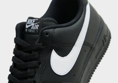 Lace up in a look that never changes with these men's Air Force 1 '07 sneakers from Nike. Inspired by the OG, these Black and White classics have a smooth leather upper and perforations on the toe. They feature a low-cut, padded collar for a sleek fit, while the encapsulated Nike Air unit delivers cushioning that lasts. With heritage hoops pivot circles for street-ready grip, they're finished off with contrasting Swoosh logos on the sidewalls. Black Nike Air Force 1, Black Nike Air Force, Nike Inspired, Nike Air Force 1 07, Black Nike, Jd Sports, Nike Air Force 1, Air Force 1, Nike Air Force