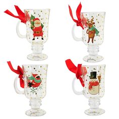 three glass mugs decorated with santa and reindeer designs, one is holding a red ribbon