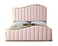 an upholstered pink bed with gold trimmings and headboard is shown