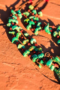 A traditional Pueblo jewelry adornment, a jacla is two loops of heishi that were originally earrings and sometimes fastened to the bottom of a stone necklace as a pendant-like attachment. Jacla is Navajo for “ear string”. Although jaclas are attributed to the Rio Grande Pueblo Indians, they were traded with other tribes so have become associated with the Navajo as well. In the oldest style necklaces, the jacla is a pair of loop earrings tied onto the necklace. The two loops would be removed from White Southwestern Hand-strung Necklaces, Southwestern Multi-strand Polished Bead Necklaces, Southwestern Multi-strand Turquoise Necklace, Navajo Traditional Necklace Turquoise, Southwestern Blue Multi-strand Turquoise Necklace, Pueblo Indians, Pebble Necklace, Loop Earrings, Native American Jewelry