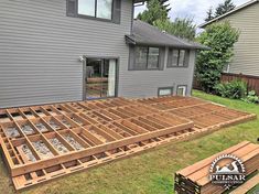 the deck is being built in front of a house