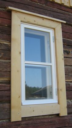 the window is made of wood and has two panes