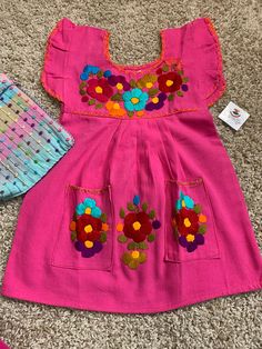 "Beautiful & Authentic Mexican Girls Dress, very fresh and light weight made with cotton blend fabric All embroidered work is Handmade, just gorgeous and unique.... Size: 2T Care Details: Hand wash only, Hang dry Measurements: 19\" long 12\" waist Great for any celebrations or good for a sunny birthday party as well. Don't wait till the last minute and email me TODAY.... All of my items come from a smoke and pet free environment. Please email me your questions before buying. Thank you for ch Cute Cotton Embroidered Spring Dress, Cute Spring Embroidered Cotton Dress, Cute Summer Embroidered Cotton Dress, Spring Cotton Embroidered Dress With Floral Applique, Pink Cotton Embroidered Dress For Spring, Cute Embroidered Cotton Dress, Spring Cotton Embroidered Dress With Machine Embroidery, Cotton Embroidered Dress With Machine Embroidery For Spring, Spring Cotton Dress With Embroidered Border