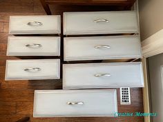 six drawers with handles and knobs are on the floor