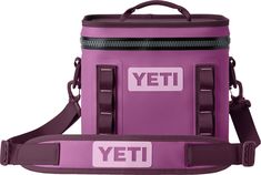 a purple yeti cooler bag with the words yeti on it and two straps