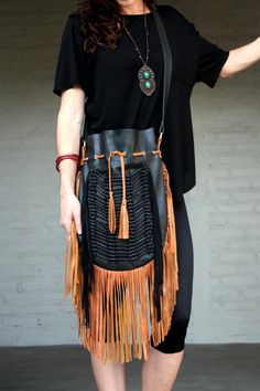 Boho style fringed leather bag black with tan fringes and black bone choker Bone bead choker attached as decoration Fully lined inside with one pocket. strap can be adjusted to several lengths. Material: leather, cow bones 26 cm wide,39 cm long. total long include leather fringes 60 cm Best finishing quality Please note that our products are handmade with some natural materials. For this reason the used materials such as leather and feathers may have slight variations in color. Please do not for Black Fringe Shoulder Bag For Travel, Black Travel Shoulder Bag With Tassels, Black Tasseled Hobo Bag, Black Bohemian Bag With Fringe, Bohemian Shoulder Bag For Fall, Bohemian Leather Hobo Bag For Fall, Black Fringe Shoulder Bag For Festival, Black Fringed Shoulder Bag For Festival, Black Shoulder Bag With Tassels For Everyday Use