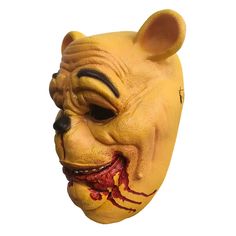 a yellow mask with an animal's face painted on it