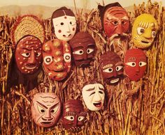 many masks are placed in the middle of a cornfield