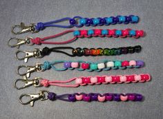 four different colored lanyards with hearts on them