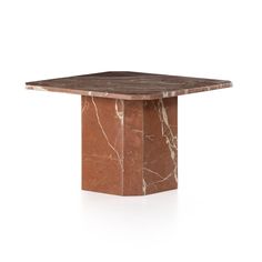 a square marble table with a brown base