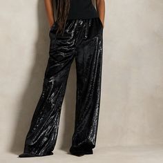 The elegant drape of velvet fabric with a metallic sheen brings a luxe point of view to these pants which are constructed with a wide-leg silhouette. Elegant Ralph Lauren Wide-leg Pants, Luxury Wide-leg Evening Bottoms, Formal Velvet Wide Leg Bottoms, Luxury Wide-leg Pants For Evening, Elegant Velvet Trousers, Elegant Straight Velvet Pants, Chic Ralph Lauren Wide-leg Pants, Elegant Wide Leg Velvet Bottoms, Velvet Full Length Bottoms For Evening