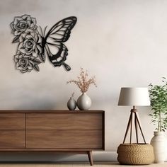 a living room with a dresser and vases