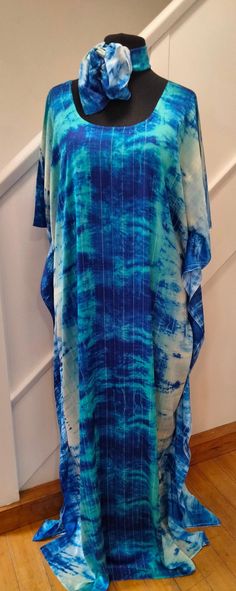 Unique handmade silk kaftan  One size fits all (fits up to size 26) Length 62 inches  Comes with a matching scarf Blue Batwing Sleeve Kaftan For Summer, Summer Blue Kaftan With Batwing Sleeves, Casual Silk Kaftan For The Beach, Blue Oversized Kaftan For Festivals, Oversized Silk Bohemian Kaftan, Oversized Silk Kaftan For Beach, Blue Silk Tunic Kaftan, Blue Silk Summer Kaftan, Blue Flowy Silk Kaftan