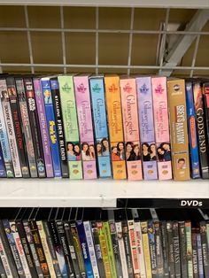 a row of dvd's on a shelf in a store