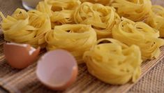 some noodles and an egg on a table