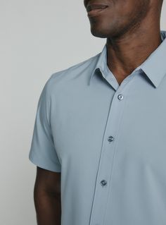 We created the perfect short sleeve button up, with the right mixture of comfort and style, just for you. Our performance shirts have 4-way stretch, are moisture wicking, wrinkle resistant and above all a great new addition to your wardrobe. The performance shirt will be your go-to for any occasion - day to night. This is a shirt that will have you satisfied at any given time. Details Model is 6'1" and wears a size medium. Care: Machine wash cold on delicate cycle, low tumble dry, do not iron Co Light Blue Short Sleeve Shirt For Formal Occasions, Light Blue Short Sleeve Formal Shirt, Formal Light Blue Short Sleeve Shirt, Short Sleeve Business Casual Shirt, Solid Color Short Sleeve Shirt For Business Casual, Solid Short Sleeve Shirt For Business Casual, Modern Semi-formal Short Sleeve Shirt, Blue 4-way Stretch Short Sleeve Tops, Blue Short Sleeve Top With 4-way Stretch