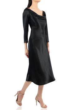 Embrace the allure of satin and indulge in the dark elegance of this cowl neck dress with sleeves. The classic black color adds a touch of mystery and allure, making it perfect for any occasion, whether it's a glamorous evening event or a chic cocktail party, this black midi sexy dress with cowl neck is always in trend. Details: 100% Cupro Silk Black Knee Length Dress Cowl Neck Dress with Sleeves Long Sleeves Dress Midi Dress Black Color Partywear/Casual Dress Dry Clean Imported Cowl Neck Dress With Sleeves, Cowl Neckline Dress, Black Dress Midi, Designer Black Dress, Black Knee Length Dress, Dark Elegance, Cowl Neck Dress, Neckline Dress, Sleeves Dress