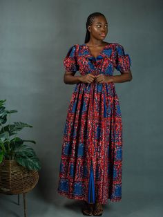 All of Elisamama’s apparel is handmade by a team of artisans in Nigeria. The puff-sleeve Ayo maxi dress is decorated with a ruffle-embellished bodice and mixed paisley prints. Crafted of cotton poplin, the style offers a plunging V-neckline and banded elasticized waist. Plunging V-neck Short puff sleeves, elasticized cuffs Banded elasticized waist Plunging V'd back 100% cotton Wash cold Hang dry or tumble dry low As with all our products, every purchase allows us to continue to further our missi Dress Shirts For Women, African Dress, Spring Dresses, Mommy And Me, Cotton Poplin, Paisley Print, Puff Sleeves, Ankara, A Team