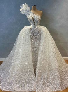 a dress made out of sequins and feathers