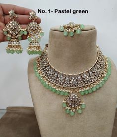 *Light Weight Kundan necklace set with earrings and tikka. *Studded with kundan stone. *Light Weight Gold kundan necklace. *Necklace width- 1.6 inches (included pearl drop) *Earrings Length- 3.5 inches(included pearl drop) *Earrings Dome Size- 1 inches Green Lehenga With Stone Work For Reception, Green Bollywood Bridal Sets For Reception, Green Bridal Sets For Diwali Reception, Diwali Reception Green Bridal Sets, Green Kundan Necklace For Receptions And Festivals, Green Kundan Necklace For Reception And Festivals, Green Tilla Jewelry Sets For Reception, Green Kundan Bridal Necklace For Reception, Green Chandbali Kundan Necklace For Wedding