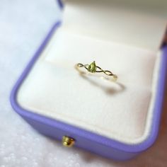 Pear Peridot Yellow Gold Solitaire Ring, August Birthstone Bypass Minimalist Silver Ring [ Made to Order ] * Metal: 925 Sterling Silver * Custom Gold Color:  Gold Vermeil in 18k Rose Gold/ 18K Yellow Gold, Sterling Silver * Main Stone Type: Peridot, Pear, 5*4mm * Gold KT: 14K Gold * Custom Gold Color: Rose Gold, Yellow Gold, White Gold * Main Stone Type: Peridot, Pear, 5*4mm Jewelry Maintenance Tips - avoid chemicals - avoid collision - clean with a soft cloth - avoid water - remove jewelry befo Green 14k Gold Promise Birthstone Ring, Green Crystal Birthstone Ring In 14k Gold, Green Birthstone Crystal Ring In 14k Gold, Dainty Peridot Ring For Gift, Dainty Peridot Ring Gift, Peridot Stackable Birthstone Ring As A Gift, Peridot Birthstone Ring For Promise Occasion, Peridot Birthstone Ring For Promise, Dainty Peridot Promise Ring