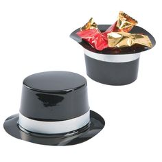 two black and white hats with gold foil wrapped in red, yellow and silver foil