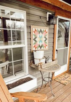 a small table and chair on a porch