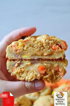 a person holding up a cookie in their hand