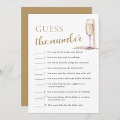 a card with the words guess the number and a glass of champagne on top of it