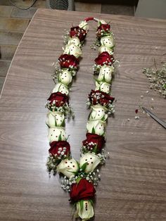 flowers arranged in the shape of a letter on a table