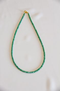 19" in length, the Barcelona necklace is a simple addition to your summer outfit or great for stacking. Made from simple rondelle beads and finished with 18k gold plated clasp. This beautiful green reminds us of the emerald waters of the gulf coast. Where will it take you? Everyday Rondelle Faceted Beads Necklaces, Everyday Rondelle Faceted Beads Necklace, Faceted Round Bead Necklaces For May Birthstone, Rondelle Emerald Necklace For Gift, May Birthstone Faceted Round Beads Jewelry, Green Necklaces With Tiny Beads For Everyday Wear, Green Faceted Beads Jewelry For Everyday, Everyday Green Jewelry With Faceted Beads, Green Faceted Beads Jewelry For May Birthstone